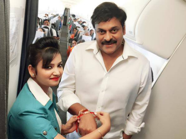 రాఖీ కడుతూ